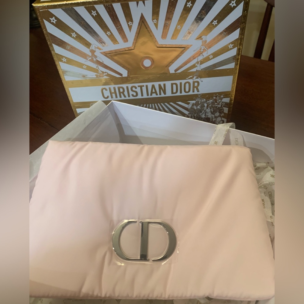 Authentic brand new puffy Christian Dior pink pouch/Clutch with Silver Accent.